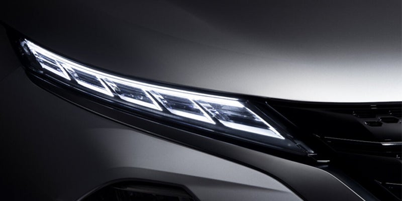 The headlights of a 2023 Mitsubishi Outlander PHEV.
