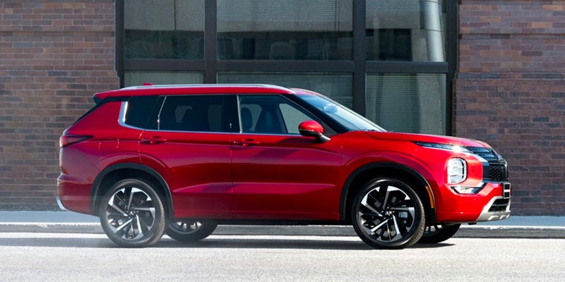 A red 2024 Mitsubishi Outlander.